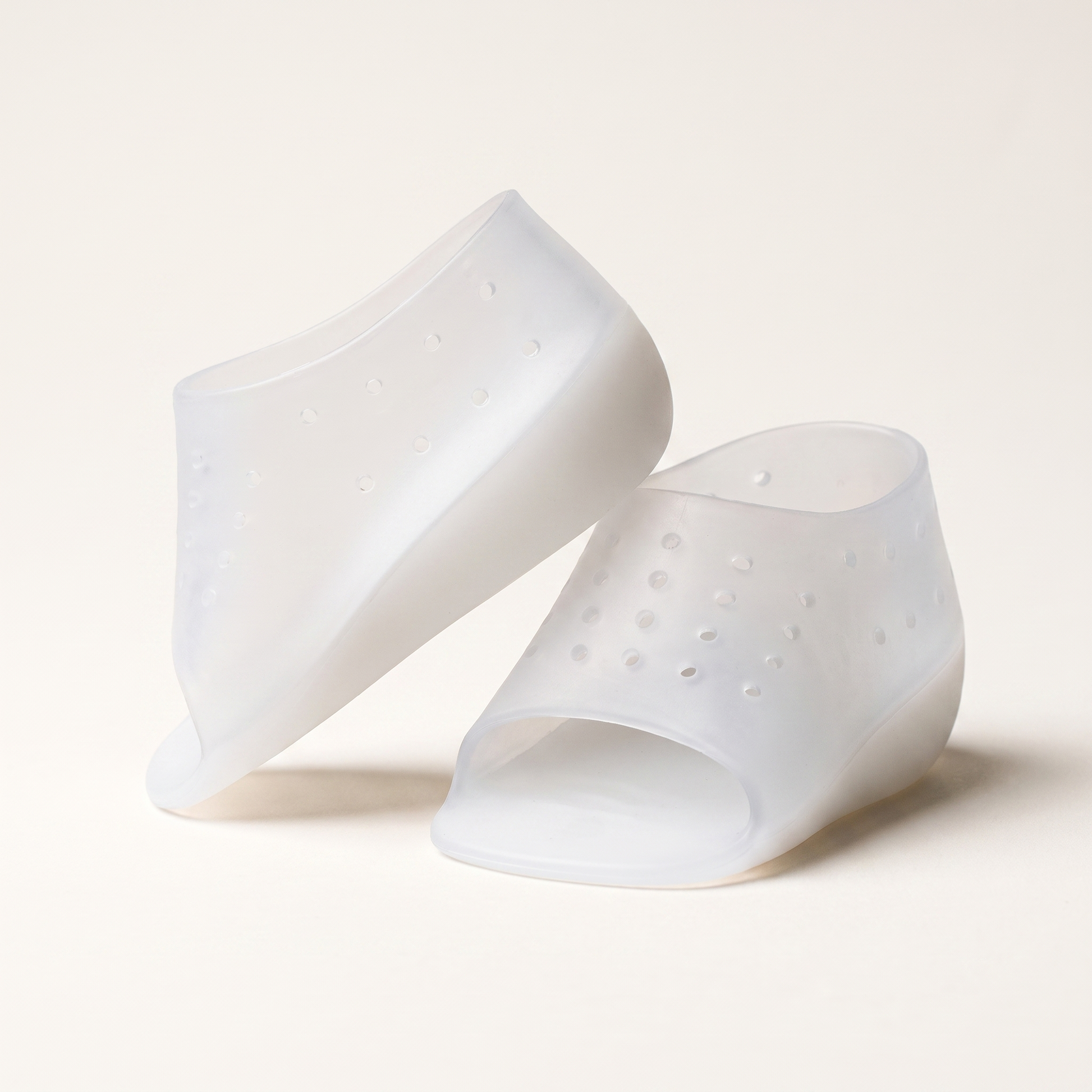 A pair of ELVO translucent silicone heel-lift sleeves