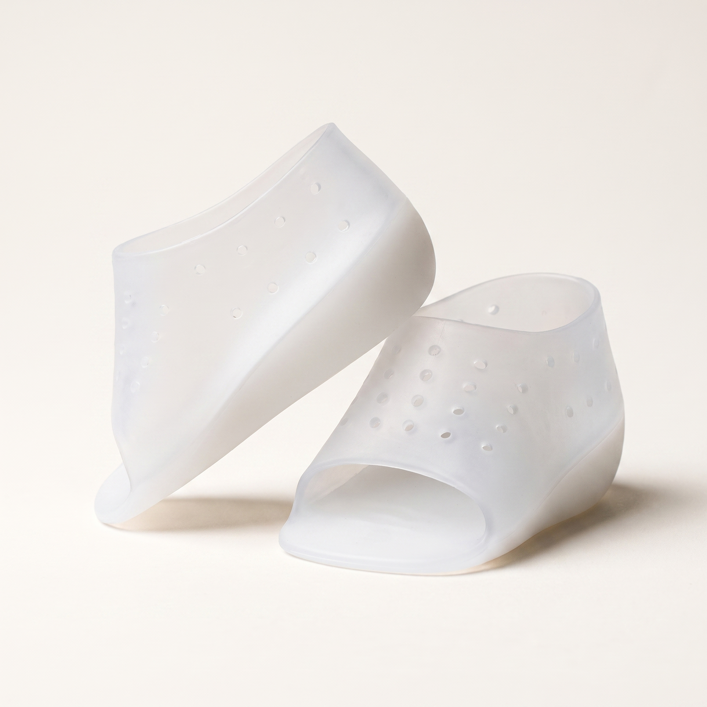 A pair of ELVO translucent silicone heel-lift sleeves