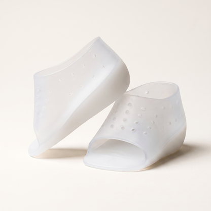 A pair of ELVO translucent silicone heel-lift sleeves